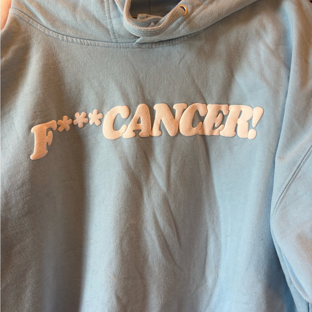 Light Blue Hoodie with Bold Statement